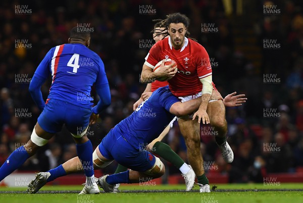 110322 - Wales v France - Guinness Six Nations - Josh Navidi of Wales is tackled by Francois Cros of France