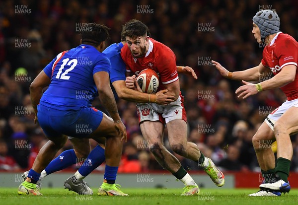 110322 - Wales v France - Guinness Six Nations - Alex Cuthbert of Wales is tackled by Romain Ntamack of France