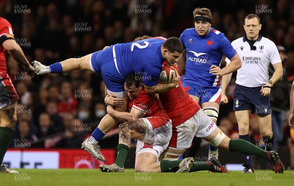 110322 - Wales v France - Guinness Six Nations - Julien Marchand of France is tackled by Ryan Elias of Wales