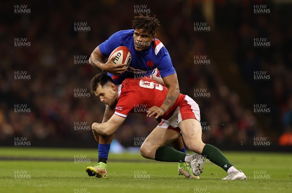 110322 - Wales v France - Guinness Six Nations - Jonathan Danty of France is tackled by Tomos Williams of Wales