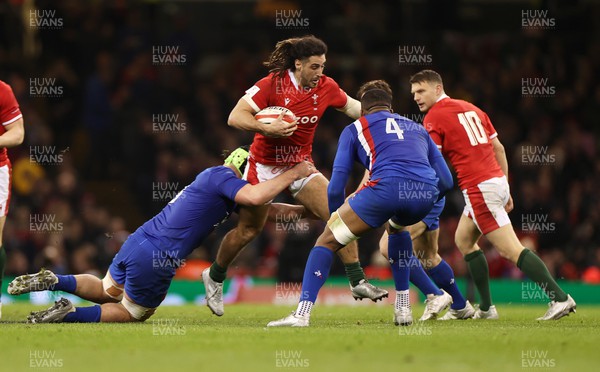 110322 - Wales v France - Guinness Six Nations - Josh Navidi of Wales is tackled by Gregory Alldritt of France