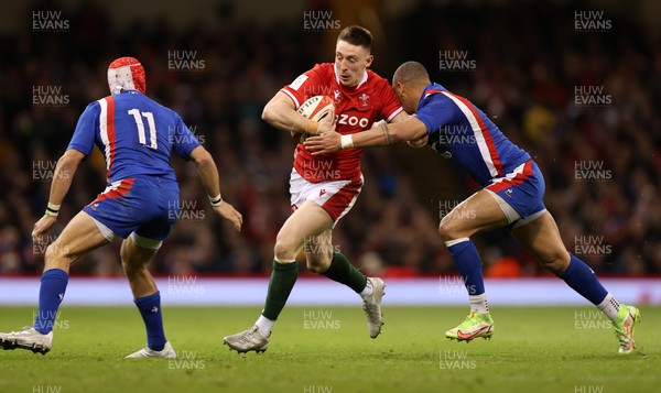 110322 - Wales v France - Guinness Six Nations - Josh Adams of Wales is tackled by Gael Fickou of France