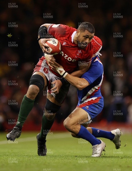 110322 - Wales v France - Guinness Six Nations - Taulupe Faletau of Wales is tackled by Gabin Villiere of France