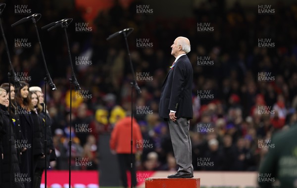 110322 Wales v France, Guinness Six Nations 2022 - Director of Music Dr Haydn James leads the choir as they entertain the crowd at the Principality Stadium ahead of the start of the match
