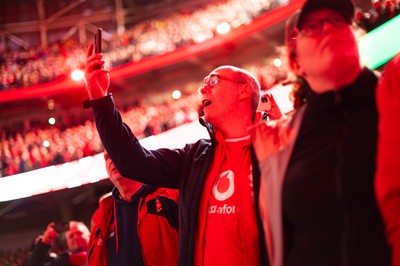 150226 - Wales v France - Guinness Six Nations - Fans sing the anthem ahead of the game 