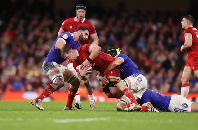 150226 - Wales v France - Guinness Six Nations Championship - Olly Cracknell of Wales is tackled by Charles Ollivon of France 