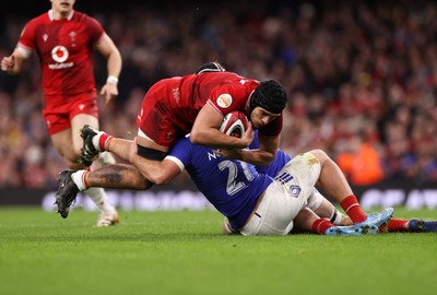 150226 - Wales v France - Guinness Six Nations Championship - Dafydd Jenkins of Wales is tackled by Lenni Nouchi of France 