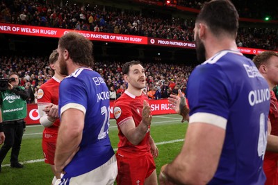 150226 - Wales v France - Guinness Six Nations Championship - Tomos Williams of Wales shakes hands with the opposition at full time