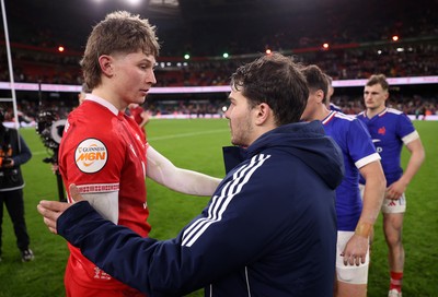 150226 - Wales v France - Guinness Six Nations Championship - Ellis Mee of Wales and Antoine Dupont of France at full time