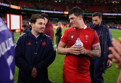 150226 - Wales v France - Guinness Six Nations Championship - Antoine Dupont of France and Louis Rees-Zammit of Wales at full time