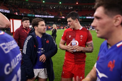 150226 - Wales v France - Guinness Six Nations Championship - Antoine Dupont of France and Louis Rees-Zammit of Wales at full time