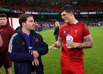 150226 - Wales v France - Guinness Six Nations Championship - Antoine Dupont of France and Louis Rees-Zammit of Wales at full time