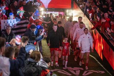 150226 - Wales v France - Guinness Six Nations Championship - Dewi Lake of Wales leads the team out with Antoine Dupont of France 