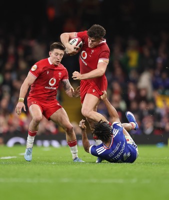 150226 - Wales v France, 2026 Guinness Six Nations - Eddie James of Wales takes on Theo Attissogbe of France