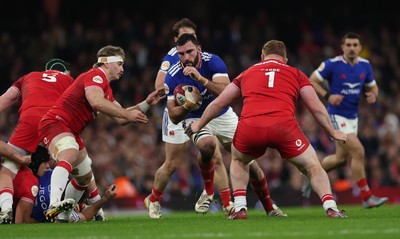 150226 - Wales v France, 2026 Guinness Six Nations - Charles Ollivon of France takes on Aaron Wainwright of Wales and Rhys Carre of Wales 