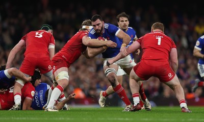 150226 - Wales v France, 2026 Guinness Six Nations - Charles Ollivon of France takes on Aaron Wainwright of Wales and Rhys Carre of Wales 