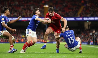 150226 - Wales v France, 2026 Guinness Six Nations - Eddie James of Wales takes on Thomas Ramos of France 