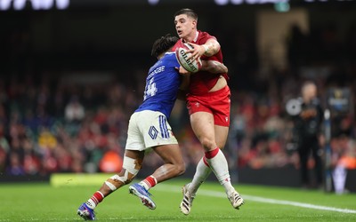 150226 - Wales v France, 2026 Guinness Six Nations - Joe Hawkins of Wales takes on Theo Attissogbe of France 