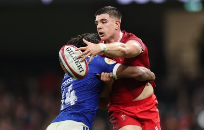 150226 - Wales v France, 2026 Guinness Six Nations - Joe Hawkins of Wales takes on Theo Attissogbe of France 