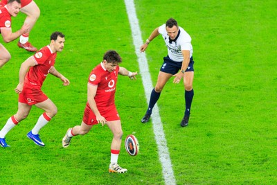 150226 - Wales v France - Guinness Six Nations - Dan Edwards of Wales re-starts the game