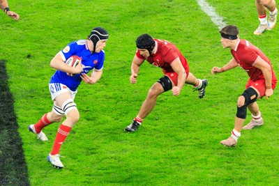150226 - Wales v France - Guinness Six Nations - Thibaud Flament of France takes on Dafydd Jenkins of Wales