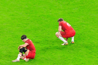 150226 - Wales v France - Guinness Six Nations - Alex Mann and Aaron Wainwright of Wales look dejected at the end of the match