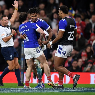 150226 - Wales v France - Guinness Men's Six Nations - Theo Attissogbe of France celebrates scoring a try with team mates