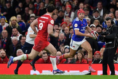 150226 - Wales v France - Guinness Men's Six Nations - Louis Bielle-Biarrey of France is challenged by Tomos Williams of Wales