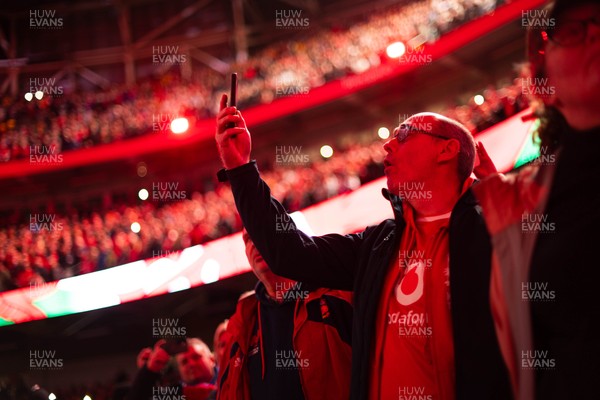 150226 - Wales v France - Guinness Six Nations - Fans sing the anthem ahead of the game 