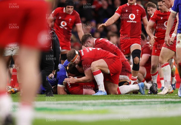 150226 - Wales v France - Guinness Six Nations Championship - Rhys Carre of Wales celebrates scoring a try with team mates