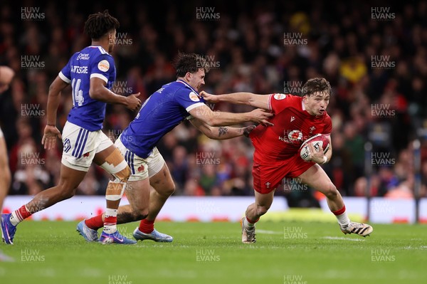 150226 - Wales v France - Guinness Six Nations Championship - Dan Edwards of Wales is tackled by Fabien Brau-Boirie of France 