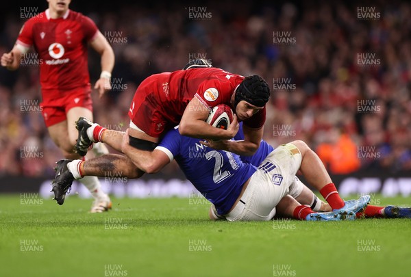 150226 - Wales v France - Guinness Six Nations Championship - Dafydd Jenkins of Wales is tackled by Lenni Nouchi of France 