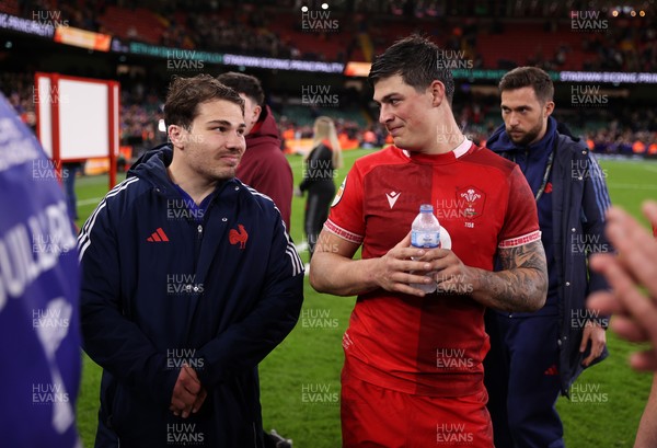 150226 - Wales v France - Guinness Six Nations Championship - Antoine Dupont of France and Louis Rees-Zammit of Wales at full time
