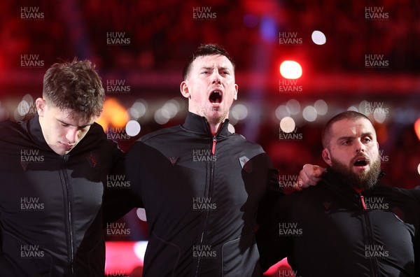 150226 - Wales v France - Guinness Six Nations Championship - Adam Beard of Wales sings the anthem
