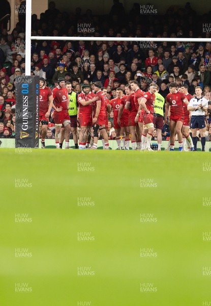 150226 - Wales v France, 2026 Guinness Six Nations - The Wales team regroup after conceding a try