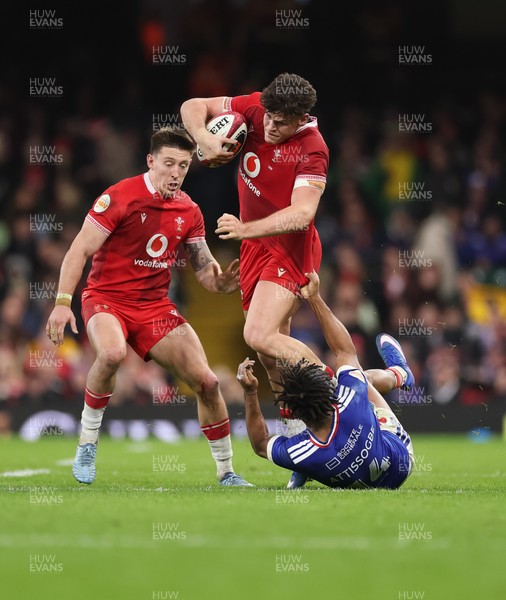 150226 - Wales v France, 2026 Guinness Six Nations - Eddie James of Wales takes on Theo Attissogbe of France