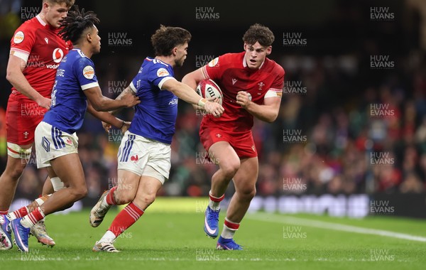 150226 - Wales v France, 2026 Guinness Six Nations - Eddie James of Wales takes on Matthieu Jalibert of France