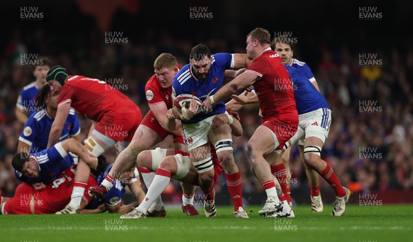 150226 - Wales v France, 2026 Guinness Six Nations - Charles Ollivon of France takes on Aaron Wainwright of Wales and Rhys Carre of Wales 