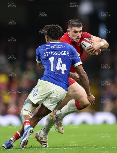 150226 - Wales v France, 2026 Guinness Six Nations - Joe Hawkins of Wales takes on Theo Attissogbe of France 