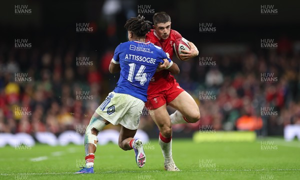 150226 - Wales v France, 2026 Guinness Six Nations - Joe Hawkins of Wales takes on Theo Attissogbe of France 