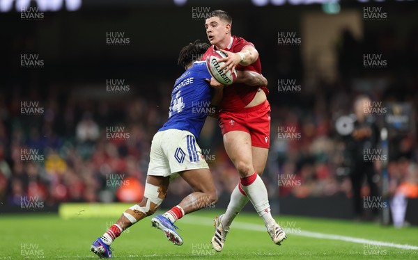 150226 - Wales v France, 2026 Guinness Six Nations - Joe Hawkins of Wales takes on Theo Attissogbe of France 