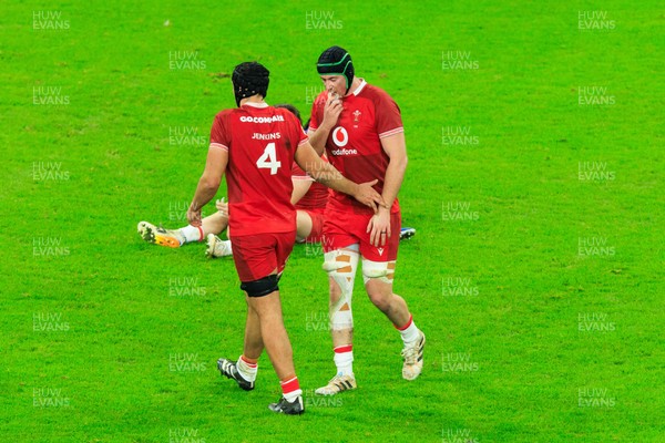 150226 - Wales v France - Guinness Six Nations - Dafydd Jenkins of Wales commiserates with Adam Beard after his attempted kick led to a try by France