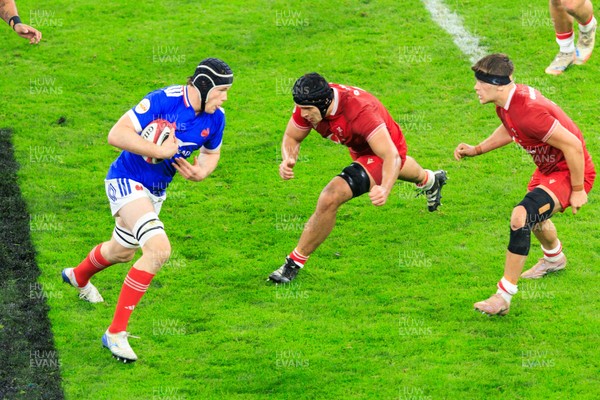 150226 - Wales v France - Guinness Six Nations - Thibaud Flament of France takes on Dafydd Jenkins of Wales