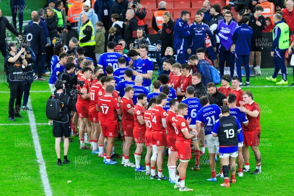 150226 - Wales v France - Guinness Six Nations - Wales players clap France off the pitch at the end of the match