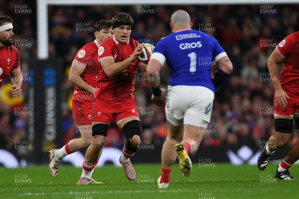 150226 - Wales v France - Guinness Men's Six Nations - Alex Mann of Wales is challenged by Jean-Baptiste Gros of France