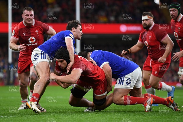150226 - Wales v France - Guinness Men's Six Nations - Dafydd Jenkins of Wales is challenged by Antoine Dupont of France