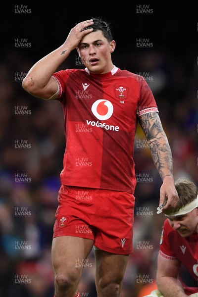 150226 - Wales v France - Guinness Men's Six Nations - Dejected Louis Rees-Zammit of Wales