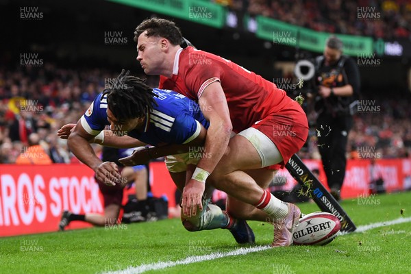 150226 - Wales v France - Guinness Men's Six Nations - Theo Attissogbe of France is challenged by Mason Grady of Wales