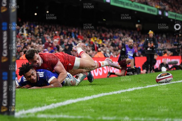 150226 - Wales v France - Guinness Men's Six Nations - Theo Attissogbe of France is challenged by Mason Grady of Wales