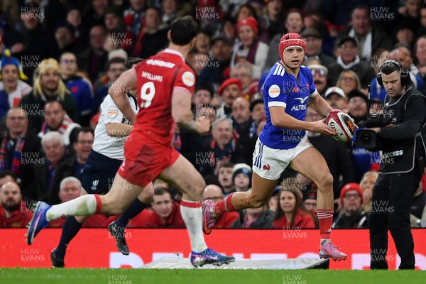 150226 - Wales v France - Guinness Men's Six Nations - Louis Bielle-Biarrey of France is challenged by Tomos Williams of Wales